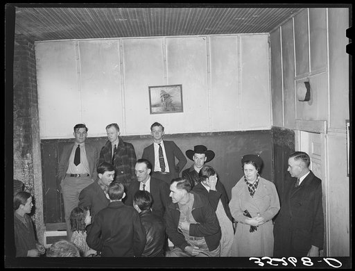 Untitled photo, possibly related to: Auctioning off the pies at pie supper in the school house. Muskogee County, Oklahoma. See general caption number 24