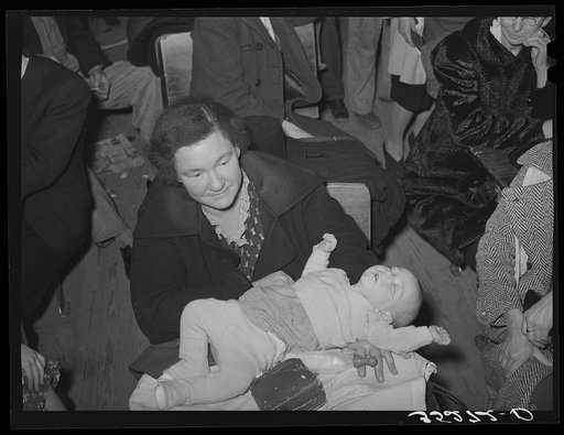 Farm woman with baby at pie supper at the school house. Muskogee County, Oklahoma. See general caption number 24