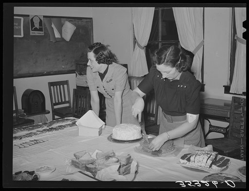 Wife of Jaycee member cutting cake at buffet supper at the high school. Eufaula, Oklahoma. See general caption number 25