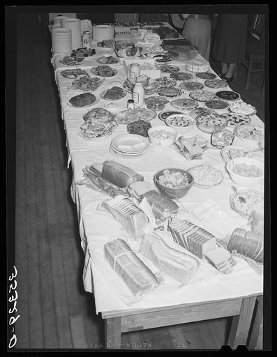 Table loaded with food, Jaycee buffet supper. Eufaula, Oklahoma. See general caption number 25