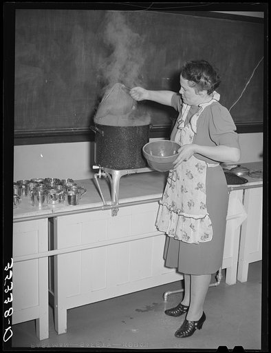 Removing bag of coffee from large pot in which the coffee was boiled for the buffet supper of the Jaycees at Eufaula, Oklahoma. See general caption number 25