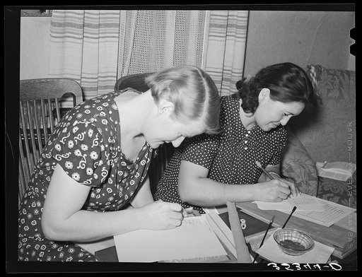 Members of home demonstration club working on contest which was determined who could make the largest number of words from the letters in the word "Washington." It was Washington's birthday. McIntosh County, Oklahoma