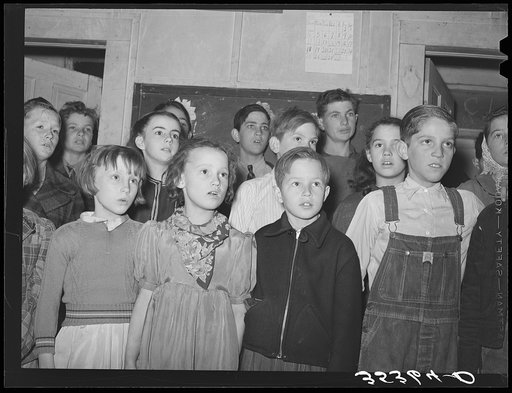 Schoolchildren singing at pie supper in Muskogee County, Oklahoma. See general caption number 24