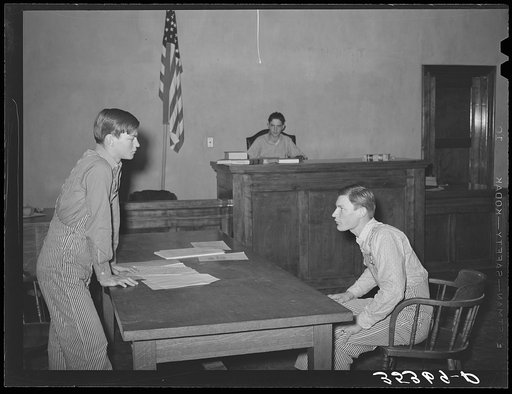 Scene from a one-act play presented at county meeting of 4-H Club. This play was in the form of a trial of Farmer Brown who was charged with cruelty to his farm. Eufaula, Oklahoma