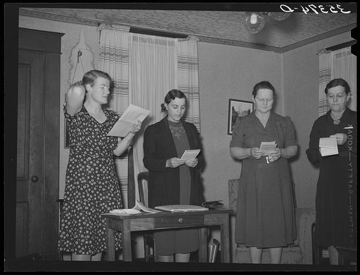 Untitled photo, possibly related to: Members of home demonstration club enumerating repairs and improvements made to their homes, thus receiving certain number of points. McIntosh County, Oklahoma