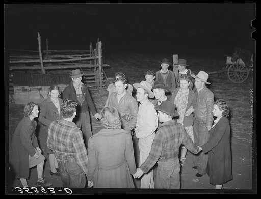 Boys and girls deciding what game to play next at play party in McIntosh County, Oklahoma. See general caption number 26