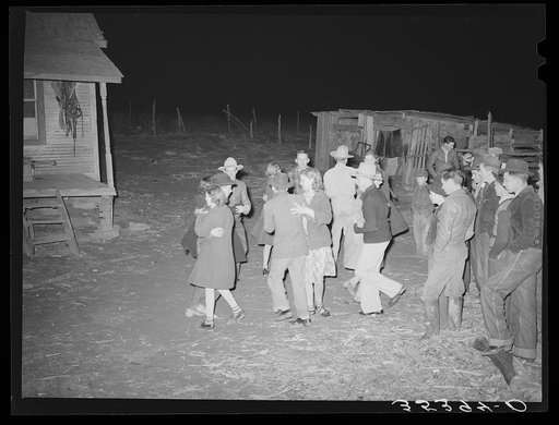 Playing a swing game in the yard. Play party in McIntosh County, Oklahoma. See general caption number 26