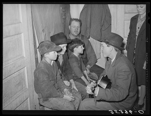 Guitar player and singers at play party in McIntosh County, Oklahoma. See general caption number 26