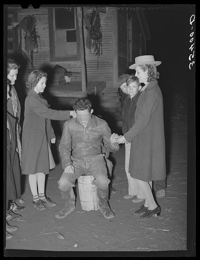 Untitled photo, possibly related to: Playing the game "Fishing for love" at play party in McIntosh County, Oklahoma. See general caption number 26