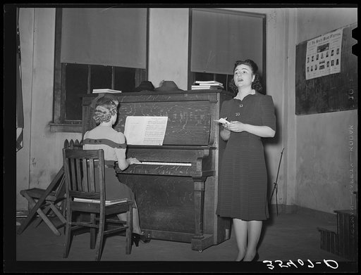 Young lady from nearby college singing at the Jaycee buffet supper and party. Eufaula, Oklahoma. See general caption 25