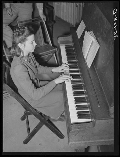 High school girl playing "America the Beautiful" as part of the Americanization program at high school. Eufaula, Oklahoma
