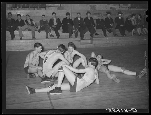 Basketball players resting between periods. Eufaula, Oklahoma
