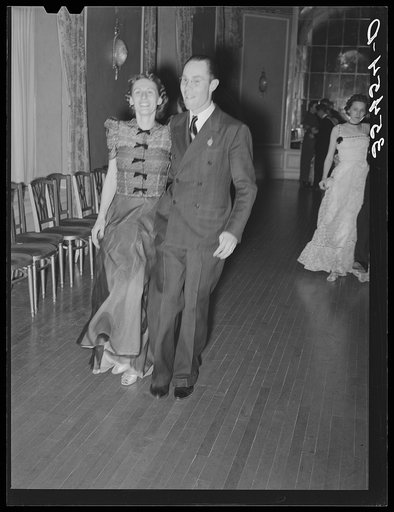 Couple dancing the polka at a dance during the San Angelo Fat Stock Show. San Angelo, Texas. The Fat Stock Show is not only attended by the cattlemen but also by their entire families and is an important social occasion in West Texas. The younger members in the families who are attending school in D