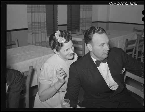 Couple sitting out a dance at a dance during the San Angelo Stock Show. San Angelo, Texas. The stock show is an important social occasion in west Texas