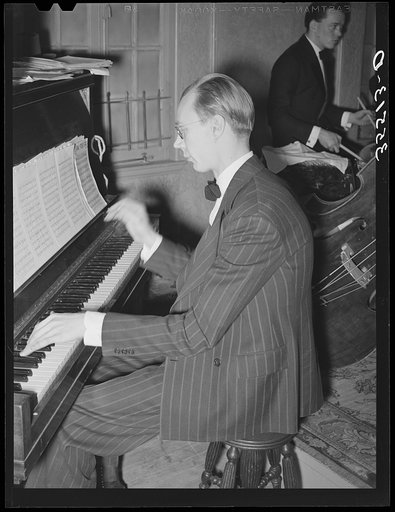 Piano player with the orchestra at a dance during the San Angelo Fat Stock Show. San Angelo, Texas