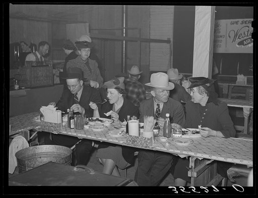 Cattlemen and their wives eating at a restaurant on the grounds of the San Angelo Fat Stock Show. San Angelo, Texas