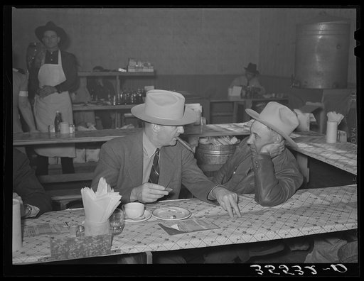 Cattlemen talking after lunch in a restaurant on the grounds of the San Angelo Fat Stock Show. San Angelo, Texas
