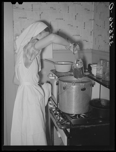 FSA (Farm Security Administration) supervisor demonstrating canning with a pressure cooker before a group of FSA supervisors and officials at a district meeting. San Angelo, Texas