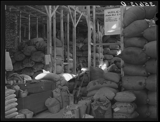 Wool and mohair in storage at Kimble County Wool and Mohair Warehouse, Junction, Texas. This company sells feed for livestock and chickens also