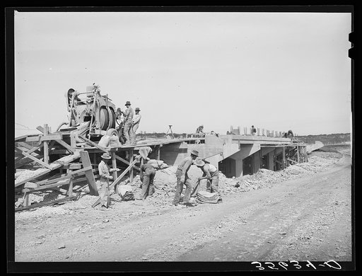 Road workers building a bridge. Menard County, Texas