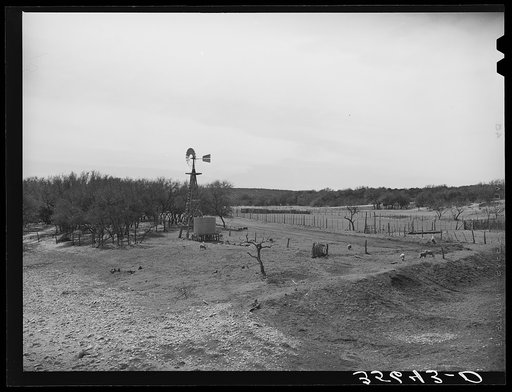 Untitled photo, possibly related to: Stock water storage tank and windmill on sheep and goat ranch in Menard County, Texas