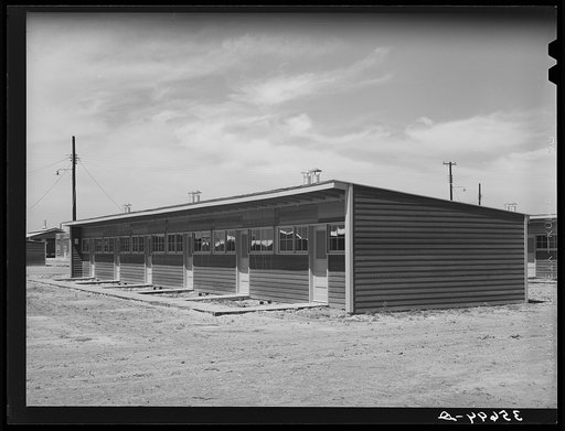Untitled photo, possibly related to: Front of row shelter for migratory workers at the migratory labor camp. Sinton, Texas