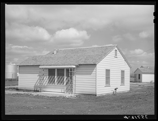 Type of house built for permanent agricultural workers at migratory labor camp. Robstown, Texas