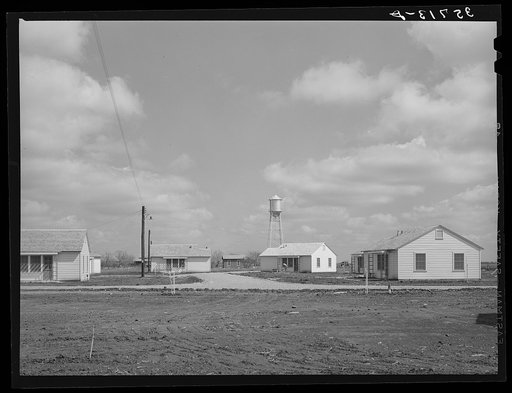 Group of houses for permanent agricultural workers at the migratory labor camp. Robstown, Texas