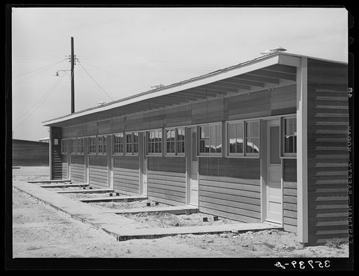 Front of row shelter for migratory workers at the migratory labor camp. Sinton, Texas
