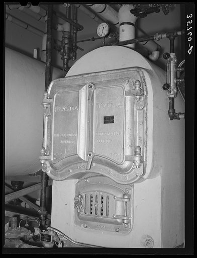 Boiler in the furnace room. Migratory labor camp, Sinton, Texas