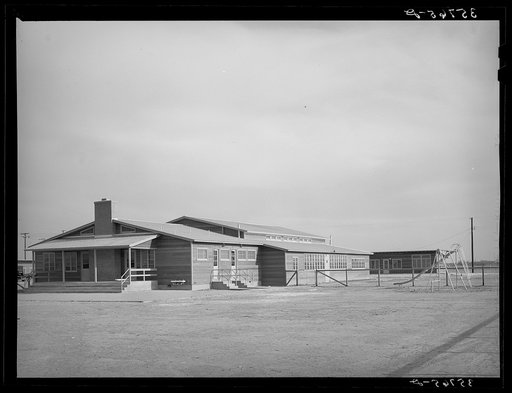 Back of community house and playground at the migratory labor camp. Sinton, Texas