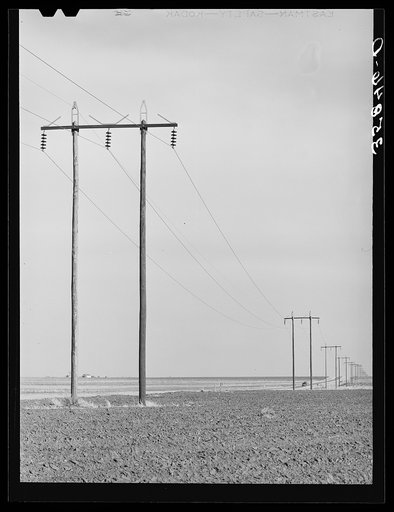 Power lines along highway in Dawson County, Texas