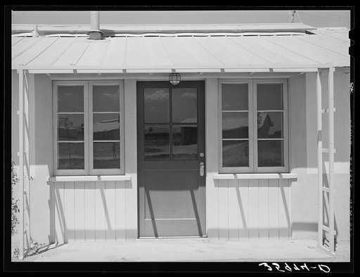 Detail of front entrance of houses designed for permanent agricultural laborers at Agua Fria migratory labor camp, Arizona