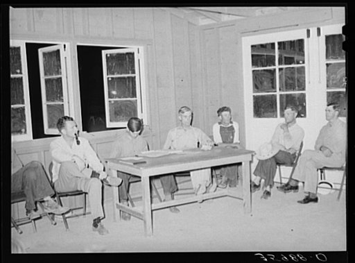 Meeting of camp committee with the camp manager at Aqua Fria migratory labor camp, Arizona. This camp committee is a governing body and determines camp policies within the limits of FSA (Farm Security Administration) regulations