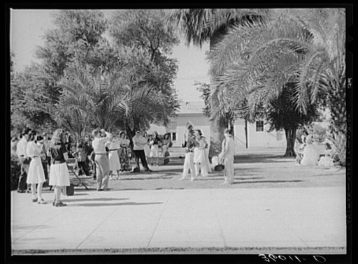 High school students watching fellow classmates being photographed in their graduation play costumes. Phoenix Union High School, Phoenix, Arizona