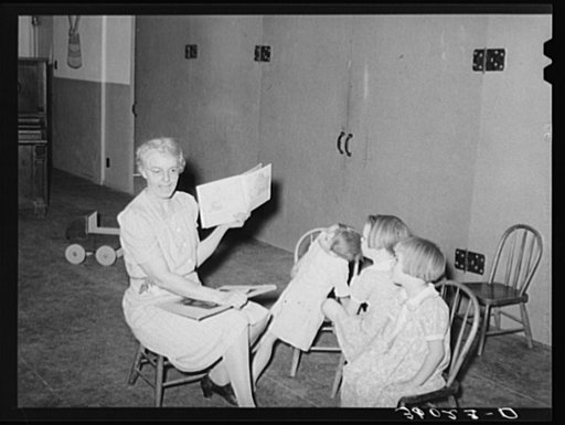 Untitled photo, possibly related to: WPA (Work Projects Administration) nursery teacher telling story to children of agricultural workers living at the Agua Fria migratory labor camp. Arizona