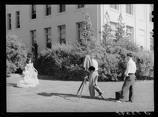 Untitled photo, possibly related to: Young high school girls being photographed in their graduation play costumes. Phoenix, Arizona