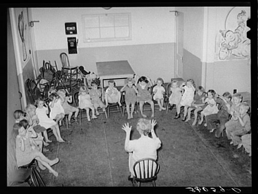 Children of migratory agricultural workers playing games, at the WPA (Work Projects Administration) nursery school at the Agua Fria migratory labor camp. Arizona