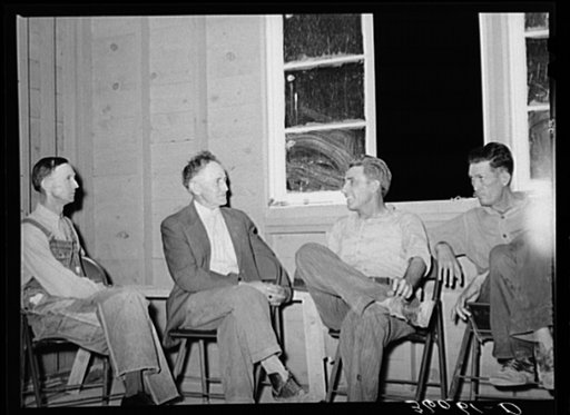 Members of the camp committee at meeting. Agua Fria migratory labor camp, Arizona