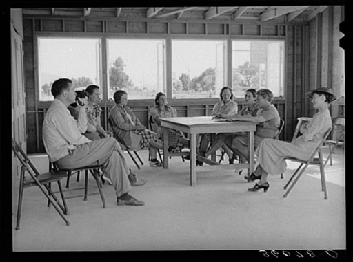 Meeting of the Ladies Aid Society with the camp manager at the Agua Fria migratory labor camp, Arizona. The Ladies Aid Society is mainly concerned with helping needy arrivals at the camp and sick persons