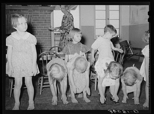 Children taking setting-up exercises at the WPA (Work Projects Administration) nursery school at Agua Fria migratory labor camp. Arizona