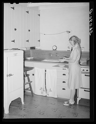 Wife of member of the Arizona part-time farms. Chandler Unit, Maricopa County, Arizona, in the kitchen of her apartment on the project