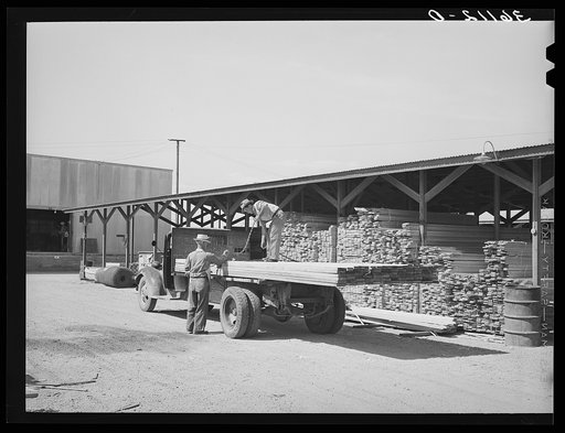 Lumber being loaded onto truck at the Producers and Consumers Cooperative. Phoenix, Arizona