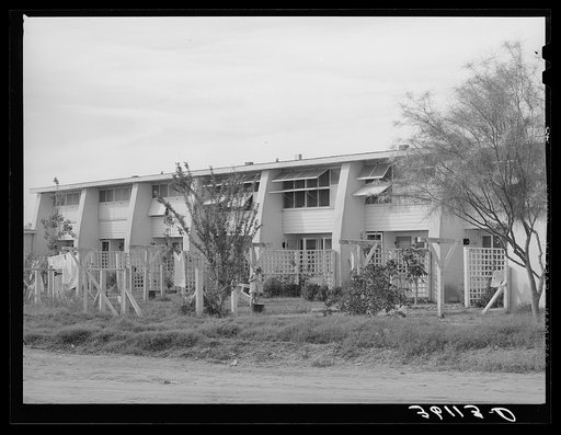 Rear view of apartment houses at the Arizona part-time farms. Chandler Unit, Maricopa County, Arizona