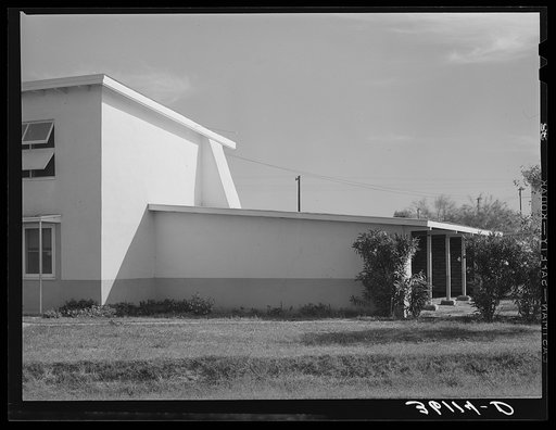 Detail of corner of apartment house and garage at Arizona part-time farms. Chandler Unit, Maricopa County, Arizona