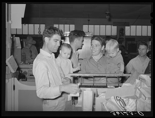 Members and their children at the wrapping desk of the United Producers and Consumers Cooperative. Phoenix, Arizona