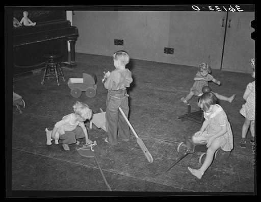 Children of agricultural laborers playing at the WPA (Work Projects Administration) nursery school at the Agua Fria migratory labor camp. Arizona