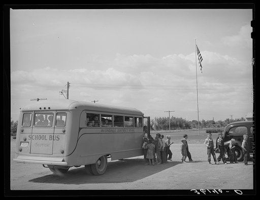 School bus bringing home children to Agua Fria migratory labor camp. Arizona