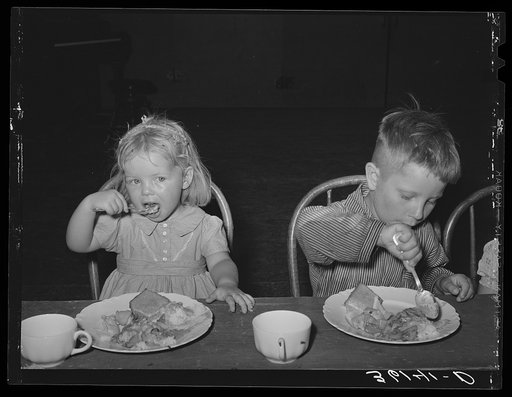 Children eating lunch at WPA (Work Projects Administration) nursery school at the Agua Fria migratory labor camp. Arizona