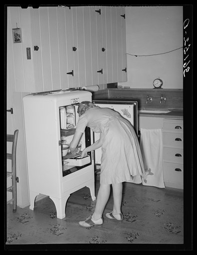 Untitled photo, possibly related to: Wife of member of the Arizona part-time farms. Chandler Unit, Maricopa County, Arizona, in the kitchen of her apartment on the project